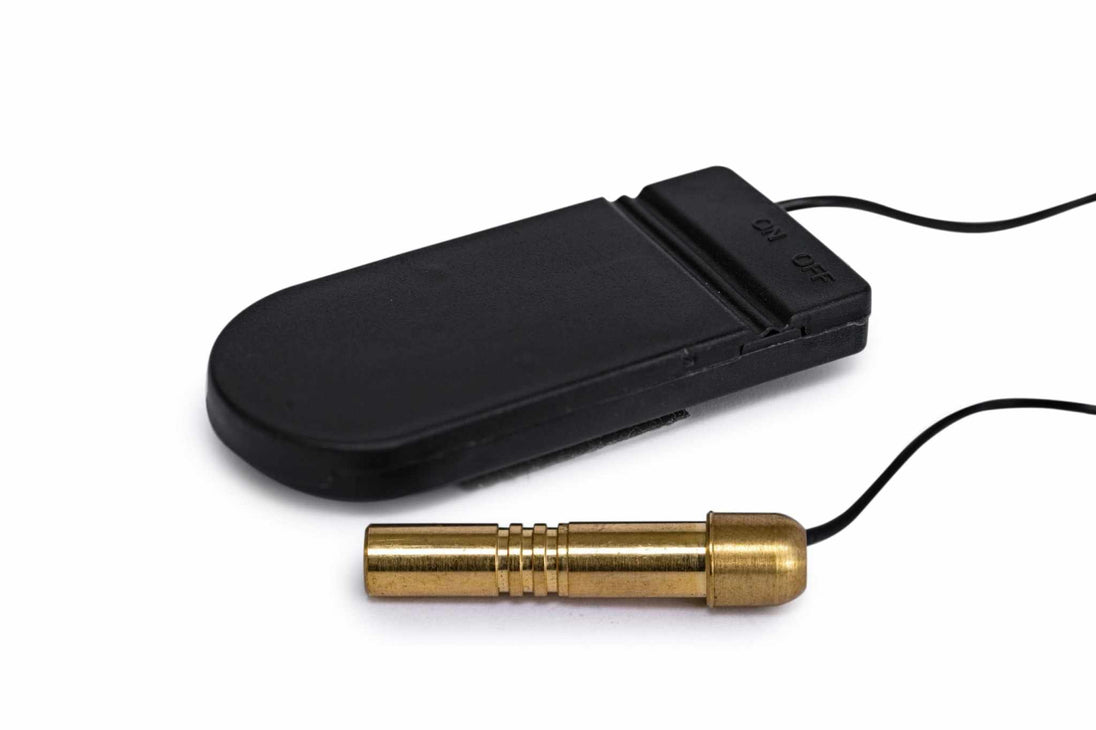 Red .22 Long Rifle Boresight with brass construction and black battery pack for laser sighting accuracy
