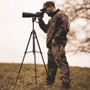 Man using Spotting Scope 20-60×80 on tripod outdoors for wildlife viewing