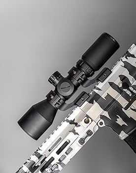 Compact 3-9x42 rifle scope with adjustable magnification, illuminated reticle options, and picatinny mounts on a camo-patterned firearm